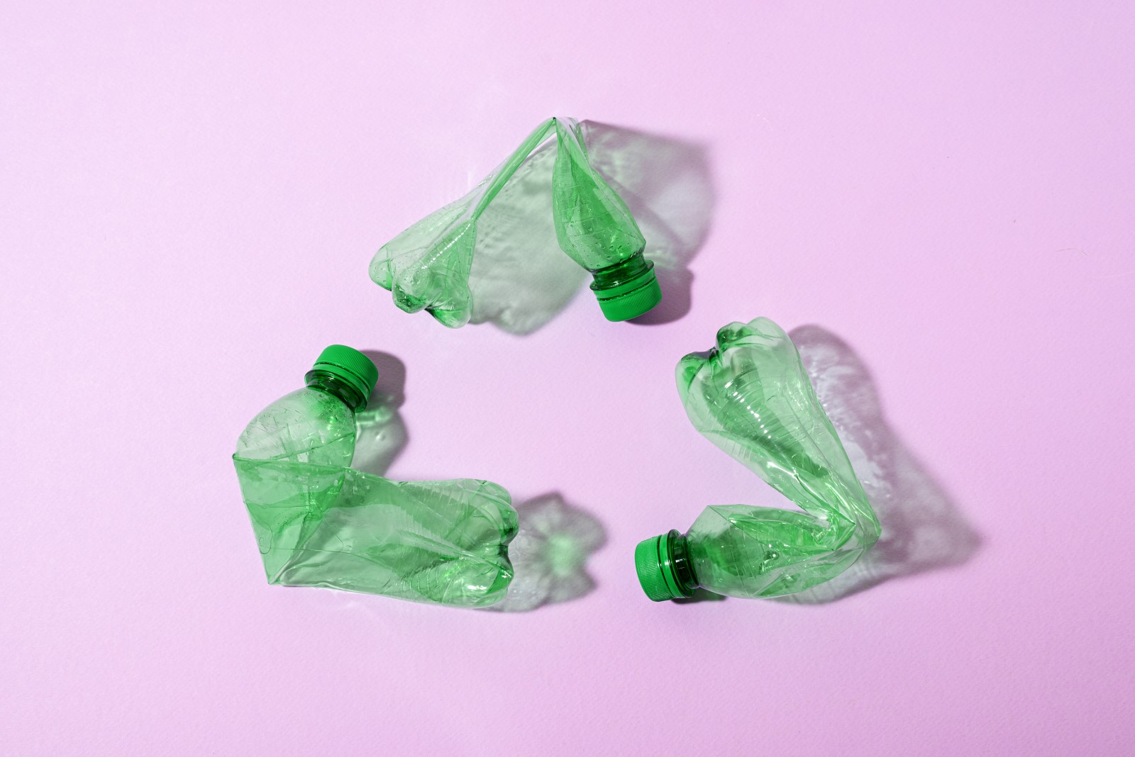 Top view green plastic bottles arrangement